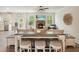 Open concept living and kitchen area featuring seating and views to the outside at 6915 Rambling Vale, Cumming, GA 30028