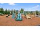 Colorful playground with slides and climbing structures, provides a fun and safe play environment at 6915 Rambling Vale, Cumming, GA 30028