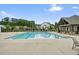 Community swimming pool with deck chairs, is nestled within a neighborhood setting at 6915 Rambling Vale, Cumming, GA 30028