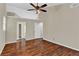 Spacious bedroom with hardwood floors, neutral paint, ceiling fan, and a vaulted ceiling at 2640 Garland Way, Duluth, GA 30096