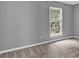 Bright bedroom with soft carpet and neutral gray walls, well lit by a sunny window at 2640 Garland Way, Duluth, GA 30096