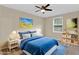 This bedroom offers a comfortable queen size bed and an ambient ceiling fan with a light fixture at 2640 Garland Way, Duluth, GA 30096