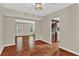 Dining room featuring hardwood floors and views into the living room and kitchen at 2640 Garland Way, Duluth, GA 30096
