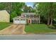 Charming two-story home with a well-manicured front yard and an attached two car garage at 2640 Garland Way, Duluth, GA 30096
