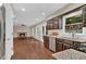 Open kitchen design with granite countertops, stainless steel appliances, and backyard views into an open living space at 2640 Garland Way, Duluth, GA 30096