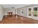 Bright living room with hardwood floors, a brick fireplace, neutral walls, and a large sliding glass door to the backyard at 2640 Garland Way, Duluth, GA 30096