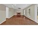 Spacious living room featuring a brick fireplace, hardwood floors, neutral paint, and a bright view at 2640 Garland Way, Duluth, GA 30096