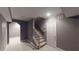 Basement entryway with carpeting, a staircase, neutral paint, and a white door at 4255 Ben Hill Rd, Atlanta, GA 30349