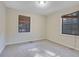 Inviting bedroom with neutral carpet, two windows with blinds, and ample natural light at 6027 Wintergreen Rd, Norcross, GA 30093