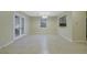 A spacious dining area with French doors, neutral walls, and tile flooring, ideal for entertaining and gatherings at 6027 Wintergreen Rd, Norcross, GA 30093