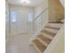 Welcoming foyer with tile flooring, natural light, and staircase leading to upper floors, creating a grand entrance at 6027 Wintergreen Rd, Norcross, GA 30093