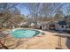Community pool area with a large pool, hot tub, and patio, perfect for summer relaxation and socializing at 6027 Wintergreen Rd, Norcross, GA 30093