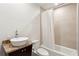 Simple bathroom design with shower tub combination and a marble topped vanity at 845 Spring Nw St # 408, Atlanta, GA 30308