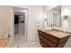 Elegant bathroom with a vessel sink, marble countertop, and access to a walk-in closet at 845 Spring Nw St # 408, Atlanta, GA 30308