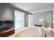Bedroom with plush carpeting, a television, and lots of natural light at 845 Spring Nw St # 408, Atlanta, GA 30308