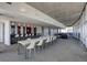Bright, spacious common area with a long table, seating, and floor-to-ceiling windows at 845 Spring Nw St # 408, Atlanta, GA 30308
