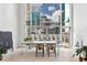 Bright dining room featuring floor to ceiling windows and a modern table set at 845 Spring Nw St # 408, Atlanta, GA 30308