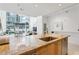 Bright kitchen with a marble countertop and large windows overlooking the city at 845 Spring Nw St # 408, Atlanta, GA 30308