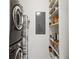 Laundry area with washer and dryer with built-in shelving on the right at 845 Spring Nw St # 408, Atlanta, GA 30308