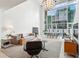 Open-concept living room with high ceilings and large windows at 845 Spring Nw St # 408, Atlanta, GA 30308