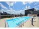 Stunning rooftop pool with city skyline views on a sunny day at 845 Spring Nw St # 408, Atlanta, GA 30308