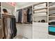 Spacious walk-in closet with custom shelving, hanging rods, and organized storage solutions at 845 Spring Nw St # 408, Atlanta, GA 30308