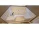 The bathroom features a large soaking tub with tile surround and chrome fixtures at 1934 Mcconnell Rd, Grayson, GA 30017