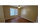Bedroom with hard wood floors, ceiling fan and a large window at 1934 Mcconnell Rd, Grayson, GA 30017