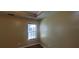 Bedroom featuring laminate flooring, neutral paint, and window with blinds at 1934 Mcconnell Rd, Grayson, GA 30017