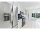 Kitchen featuring stainless steel appliances, granite countertops, and ample cabinet space at 1934 Mcconnell Rd, Grayson, GA 30017