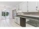 Bright kitchen featuring granite countertops, stainless steel appliances, and a sliding glass door at 1934 Mcconnell Rd, Grayson, GA 30017