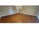 Living room with hardwood floors and a pendant light at 1934 Mcconnell Rd, Grayson, GA 30017