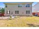 Backyard with grassy lawn, patio set, garden beds, and a two-story home exterior at 832 Topaz Vly, Canton, GA 30114