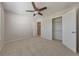 Bright bedroom with ceiling fan, carpet, and a walk-in closet at 832 Topaz Vly, Canton, GA 30114
