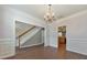 Dining room with staircase and view of the kitchen and hardwood flooring at 832 Topaz Vly, Canton, GA 30114