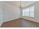Bright dining room features a modern chandelier, white molding, and large window at 832 Topaz Vly, Canton, GA 30114