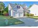 Charming two-story home featuring a two-car garage and a well-manicured front lawn at 832 Topaz Vly, Canton, GA 30114