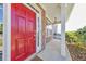 Close up of a bright red front door with stone facade and a hanging lantern at 832 Topaz Vly, Canton, GA 30114