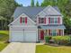 Charming two-story home with red shutters and a well-maintained front yard at 832 Topaz Vly, Canton, GA 30114