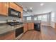 Kitchen features modern appliances, breakfast bar, and open dining space at 832 Topaz Vly, Canton, GA 30114