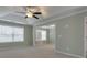 Bright living room with carpeting, large windows, tray ceiling, and fresh paint at 832 Topaz Vly, Canton, GA 30114