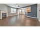 Open concept living room with hardwood floors, fireplace, and bright windows at 832 Topaz Vly, Canton, GA 30114