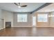 Open-concept living room with fireplace, large windows, and ample natural light at 832 Topaz Vly, Canton, GA 30114