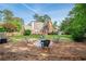 The backyard features a fire pit with a seating area and a view of the home at 9810 Foxworth Dr, Alpharetta, GA 30022
