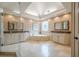 Spacious primary bathroom featuring a soaking tub, dual sinks, and a glass enclosed shower at 9810 Foxworth Dr, Alpharetta, GA 30022