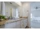 Bathroom featuring double vanity with granite countertop and access to bedroom at 9810 Foxworth Dr, Alpharetta, GA 30022