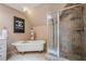 Stylish bathroom featuring a soaking tub, tile shower, and a modern design at 9810 Foxworth Dr, Alpharetta, GA 30022