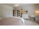 Comfortable bedroom with bright natural light, vanity, and ensuite bathroom at 9810 Foxworth Dr, Alpharetta, GA 30022