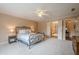 Large, bright bedroom with a view of an en suite bathroom at 9810 Foxworth Dr, Alpharetta, GA 30022