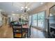Open dining area, with a fireplace, seamlessly connected to the kitchen at 9810 Foxworth Dr, Alpharetta, GA 30022